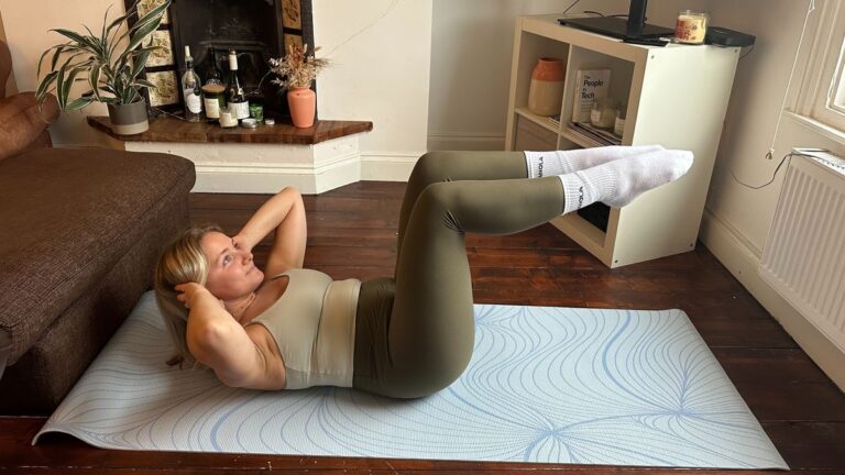 The author performs the crunch and knee raise