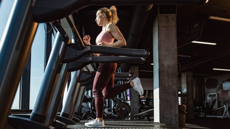 Woman running on a treadmill in the gym