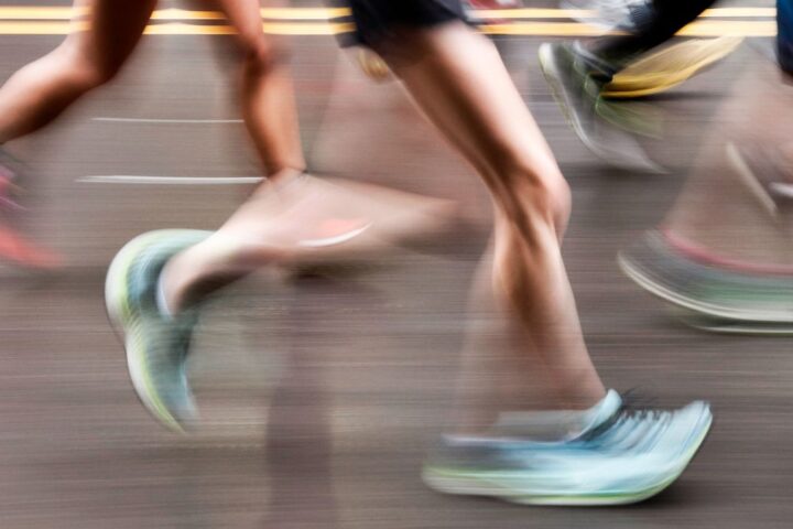 Feet of runners, photographed with motion blur