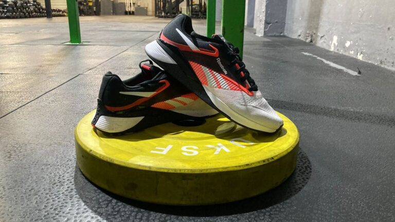 Reebok Nano X4 CrossFit shoes on a bumper plate