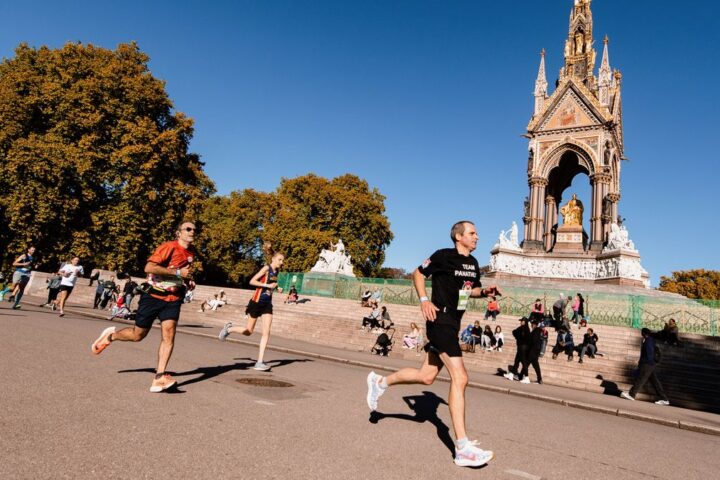 Runners in the Royal Parks Half Marathon run past the Albert Memorial in Kensington Gardens, London